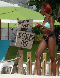 Candid black family, milf and teens on the beach in bikinis