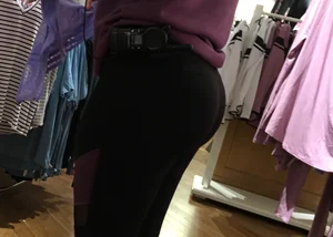 Pink employee with a perfectly round ass in leggings
