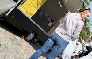 Cute blonde in tight blue jeans