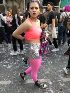 Hot carnival girl in in a top, mini shorts with pink frill and awesome legs in fishnet pantyhose