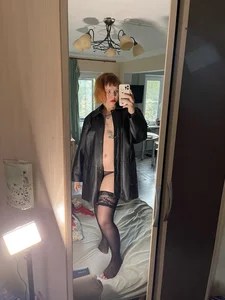 Topless Ginger Girl in Panties, Torn Stockings And a Leather Jacket Bedroom Selfies