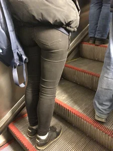 Booty in Tight Black Jeans on the Escalator Closeup Candid Photo