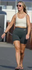 Blonde woman in lycra shorts - good front view, back view ruined by a bag