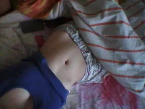 Girl in Bed with T-Shirt Pulled Up Selfie