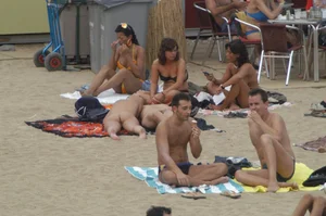 Topless girls on a beach in Barcelona