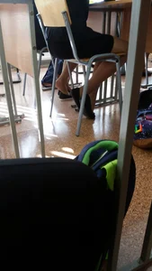 Crossed Skinny Legs of a Candid College Teen in a Classroom Creepshot