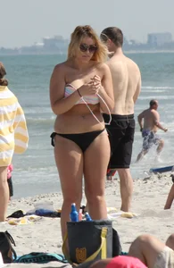 Big boobed thick blonde on the beach in a bikini