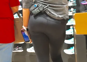 Shoe store employee with a sexy bubble butt in leggings