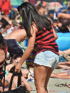 Pretty brunette in a bikini at the beach