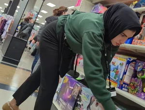 Hijab Princess stocking shelves @ department store