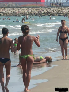Bunch of sexy babes at the beach in thong bikinis