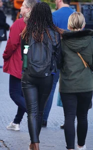 Black babe out in tight shiny pants with slight vpl