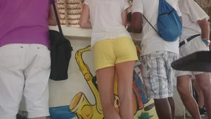 Milf in yellow shorts with vpl and a wedgie