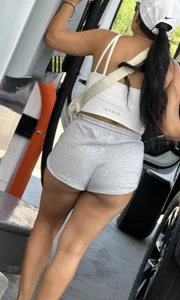 Sexy fit latina with cheeks coming out of booty shorts