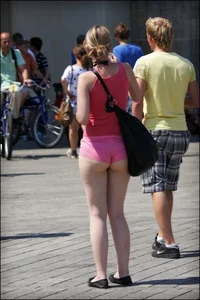 Girl showing serious ass cheeks and great ass in tiny pink shorts
