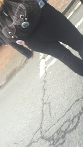 Girl with a nice ass in leggings walking down the street