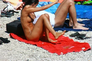 Ula FKK Sexy brunette on a nude beach topless, bottomless and with blue thong