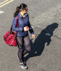 Brunette lady in leggings out walking