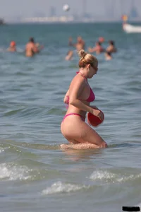 A bunch of sexy beach voyeur babes in bikinis, thongs and topless