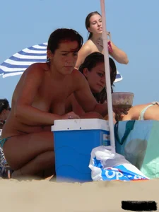 2 topless thonged sexy friends on the beach with great bodies