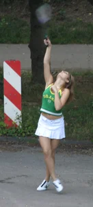 Pretty girl playing tennis in a skirt and walking in jeans