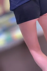 Sexy fit ass in mini shorts and slim legs closeups