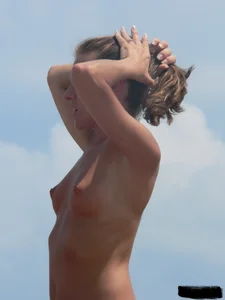 Two topless friends on the beach with nice boobs