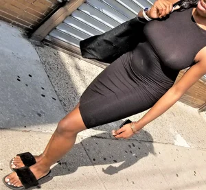Sexy braless ebony babe in tight skirt with pokies