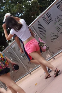 Sexy girl in pink shorts showing some cheek