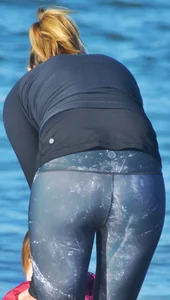 Beach redhead milf in patterened leggings at the beach