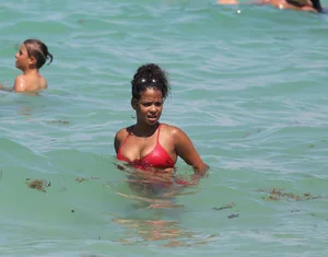 Christina Milian in red bikini in Miami with hard nipples