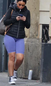 Wide hipped, juicy fronted tanned brunette pawg struts in lycra shorts