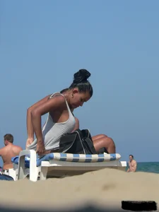 Hot ass topless beach girl with great tits lets her little brother oil up her ass in thong bikini