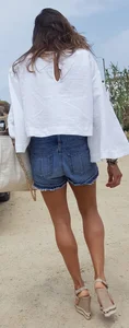 Flat ass leggy girl in denim shorts
