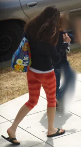 Beautiful brunette teen in orange patterned leggings