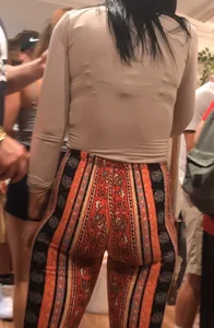 Big fat ass in pattern flare pants with some pokey pierced nipples in a blue crop top