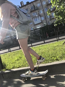 Girl in Denim Shorts on Skateboard Street Candid Photos