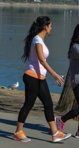 Thick lady walking in leggings with a big booty