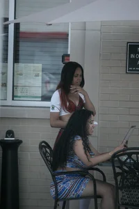 Two sexy Tilted Kilt employees showing cleavage and cheeks