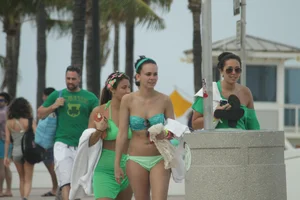 Saint Patrick's Day girls in bikinis at Deerfield Beach in Florida