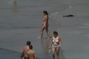 Girls on a nude beach in Sitges, Spain