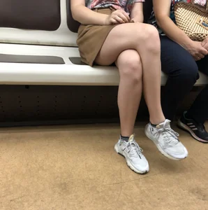 Amazing Hot Girl in a Skirt and Sneakers Sitting Cross-Legged in the Subway Train and on the Escalator Candid Photos Gallery