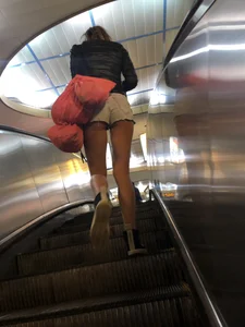 Hot Milf in Mini Shorts on the Subway Escalator and in the Train Candid Gallery