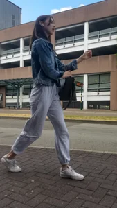 A very cute street candid teen in sweatpants and sneakers