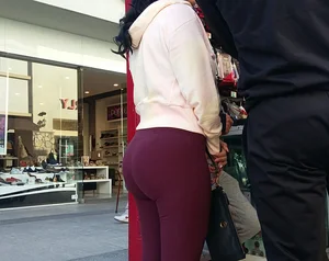 Brunette with a great ass in tight maroon leggings