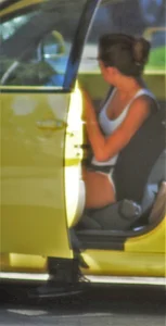 Skinny babe going to her car in little cotton shorts