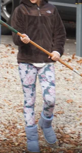 Skinny teen neighbor raking leaves in tight floral patterned leggings