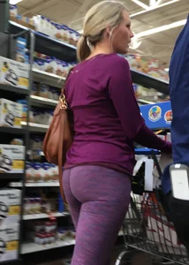 Sexy blonde shopping at Walmart in purple leggings with some vpl