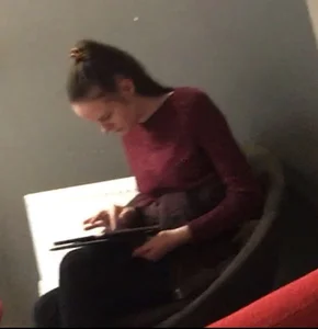 Young Skinny Girl Sitting With a Tablet