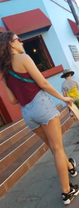 Laughing girl in shorts, legs and thick peach